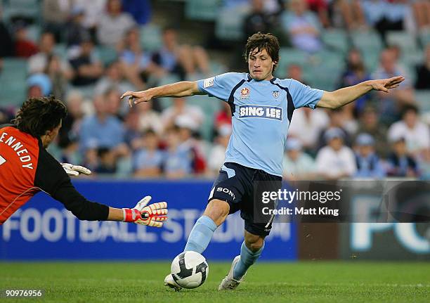 Chris Payne of Sydney tries to get past goalkeeper Ben Kennedy of the Jets during the round seven A-League match between Sydney FC and the Newcastle...