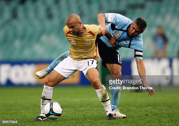 Fabio Vignaroli of the Jets competes with Steve Corica of Sydney during the round seven A-League match between Sydney FC and the Newcastle Jets at...