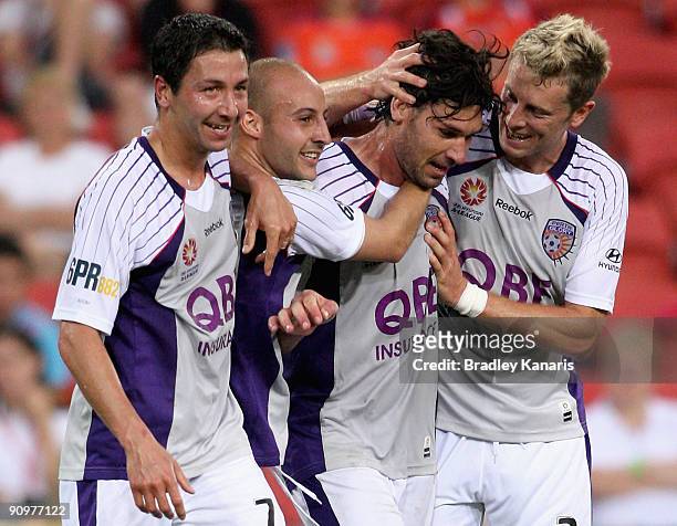 Wayne Srhoj of the Glory celebrates with team mates after scoring a goal during the round seven A-League match between the Brisbane Roar and Perth...