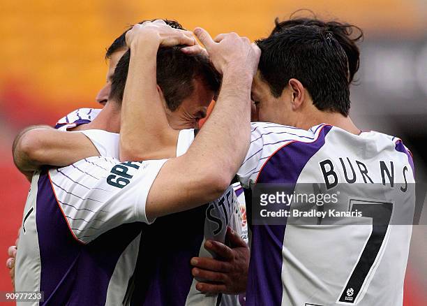 Jamie Harnwell of the Glory celebrates with team mate Jacob Burns after scoring a goal during the round seven A-League match between the Brisbane...