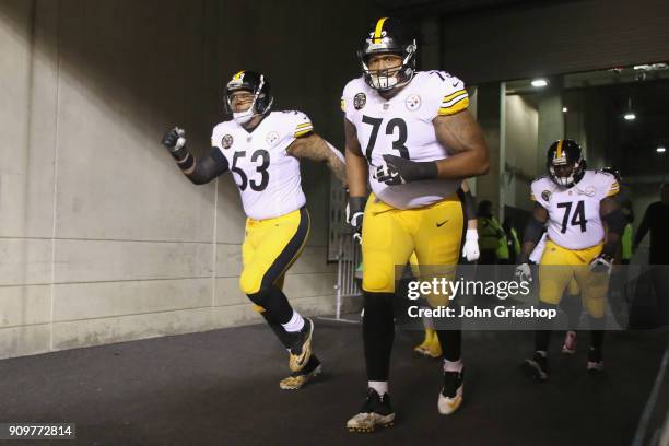 Ramon Foster of the Pittsburgh Steelers and teammate Maurkice Pouncey take the field for the game against the Cincinnati Bengals at Paul Brown...