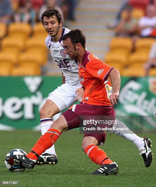 Ivan Franjic of the Roar takes on the defence during the round seven A-League match between the Brisbane Roar and Perth Glory at Suncorp Stadium on...