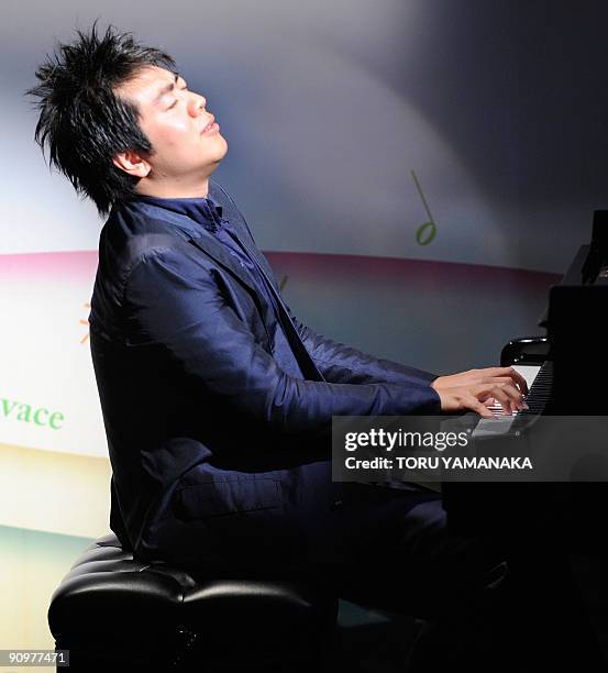 Chinese pianist Lang Lang performs during a music event for Japanese children in Tokyo on September 20, 2009. Lang is in Japan to appear in a series...