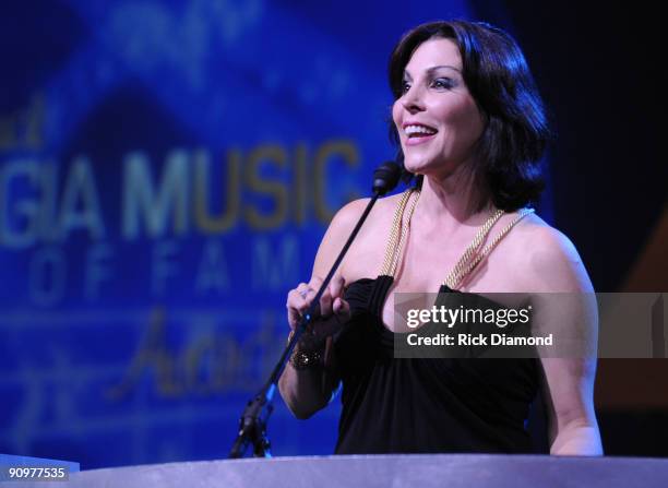 Michele Caplinger presents to inducttees Collective Soul at the 31st Annual Georgia Music Hall of Fame Awards held at The Georgia World Conference...