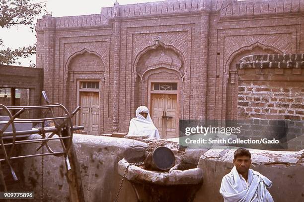 Two male villagers in a mosque courtyard, Gujarat, India, 1964. Image courtesy Centers for Disease Control .