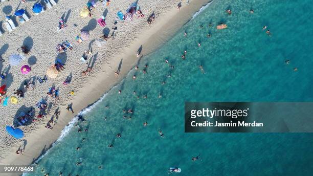 aerial view of summer sea beach - crowd of people from above stock pictures, royalty-free photos & images