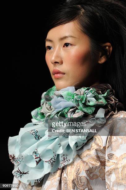 Model displays an outfit by designer Betty Jackson during Spring/Summer 2010 collection show on the third day of the London Fashion Week, in central...
