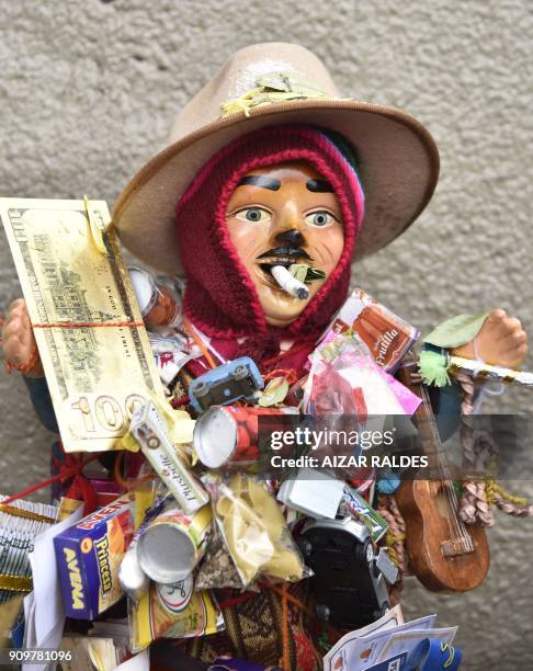 View of an Ekeko -Aymara god of abundance- statuette during the inauguuration of the Alasitas Fair in La Paz on January 24, 2018. In this and other...