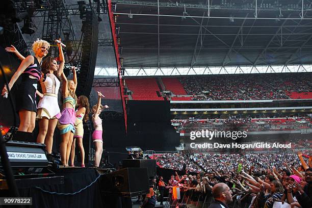 Sarah Harding, Cheryl Cole, Kimberley Walsh, Nadine Coyle and Nicola Roberts of Girls Aloud perform at Wembley Stadium as part of Coldplay's Viva La...