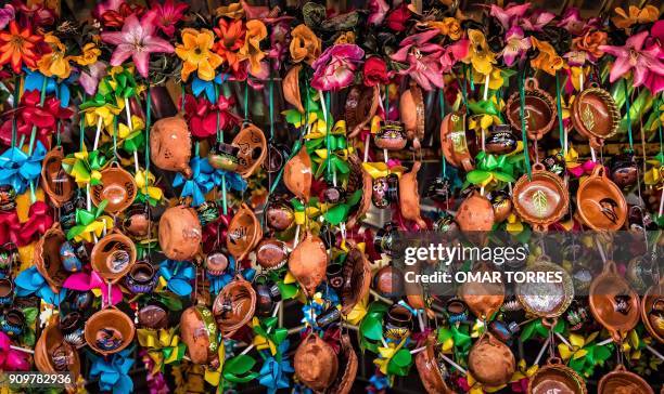 View of ornaments made with little clay pots and ribbons at a stall during the Mole Fair in San Pedro Atocpan, Milpa Alta borough, Mexico on October...