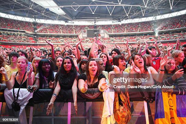 Fans of Girls Aloud at Wembley Stadium as part of Coldplay's Viva La Vida tour at Wembley Stadium on September 19, 2009 in London, England.