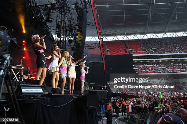 Sarah Harding, Cheryl Cole, Kimberley Walsh, Nadine Coyle and Nicola Roberts of Girls Aloud perform at Wembley Stadium as part of Coldplay's Viva La...