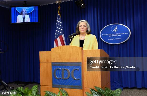 Photograph showing Julie Gerberding, a former CDC director, speaking at a news conference regarding hurricane Isabel, the West Nile virus and a...