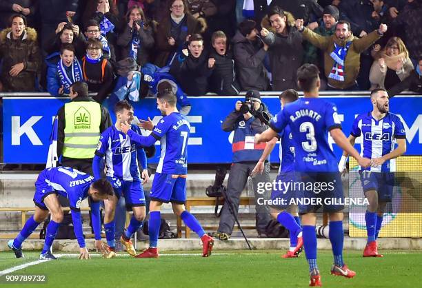 Alaves' Spanish forward Munir El-Haddadi celebrates with teammates after scoring his team's first goal during the Spanish 'Copa del Rey'...