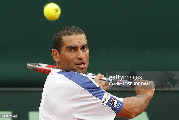 Israeli Andy Ram returns the ball against Spain's David Ferrer during the fourth match of the Davis cup semifinal between Spain and Israel at the...