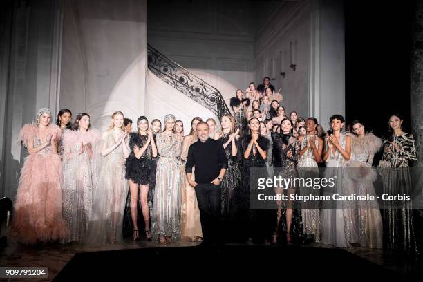 Fashion designer Elie Saab poses with models after the Elie Saab Spring Summer 2018 show as part of Paris Fashion Week on January 24, 2018 in Paris,...