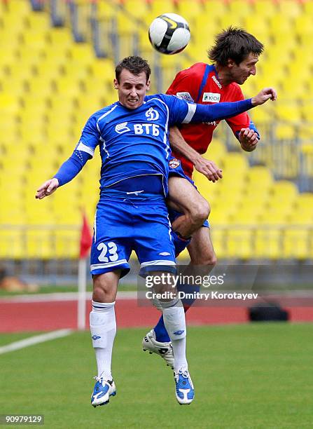 Deividas Semberas of PFC CSKA Moscow battles for the ball with Luke Wilkshire of FC Dynamo Moscow during the Russian Football League Championship...