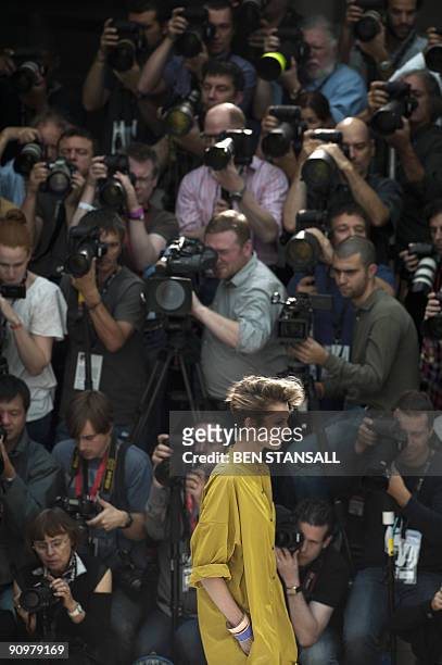 Model displays an outfits by designer Nicole Farhi during Spring/Summer 2010 collection show on the third day of the London Fashion Week, in central...