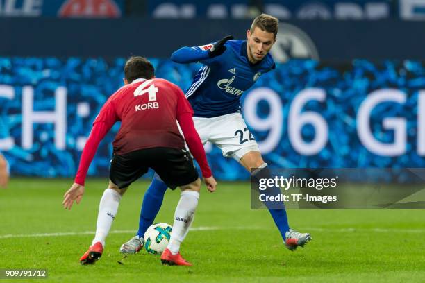 Julian Korb of Hannover and Marko Pjaca of Schalke battle for the ball during the Bundesliga match between FC Schalke 04 and Hannover 96 at...