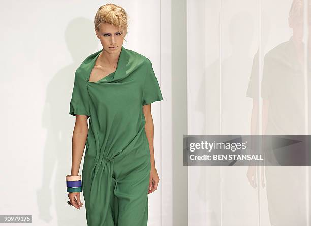 Model displays an outfits by designer Nicole Farhi during Spring/Summer 2010 collection show on the third day of the London Fashion Week, in central...