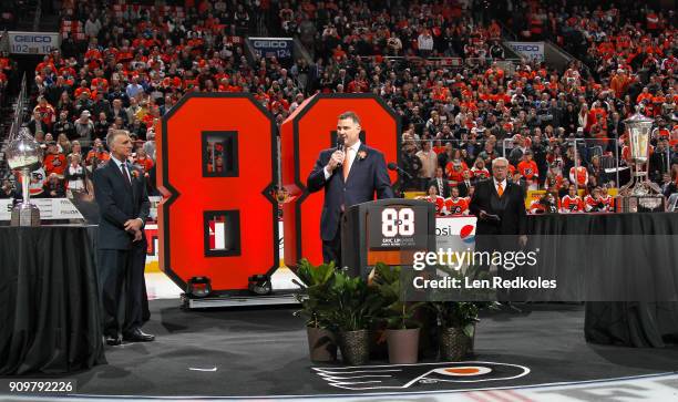 Hall of Famer and former Philadelphia Flyer Eric Lindros speaks to the crowd during his Jersey Retirement Night ceremony with Flyer President Paul...