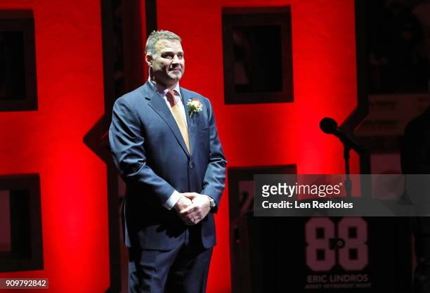 Hall of Famer and former Philadelphia Flyer Eric Lindros stands at the start of his Jersey Retirement Night ceremony prior to a NHL game between the...