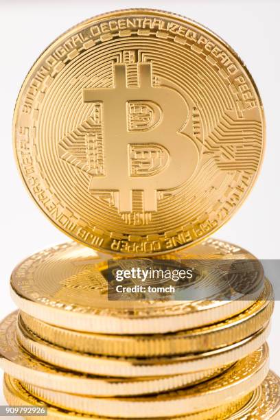 bitcoin on white background. bitcoin is a digital coin, on photo is physical representation of bitcoin. - ico stock pictures, royalty-free photos & images