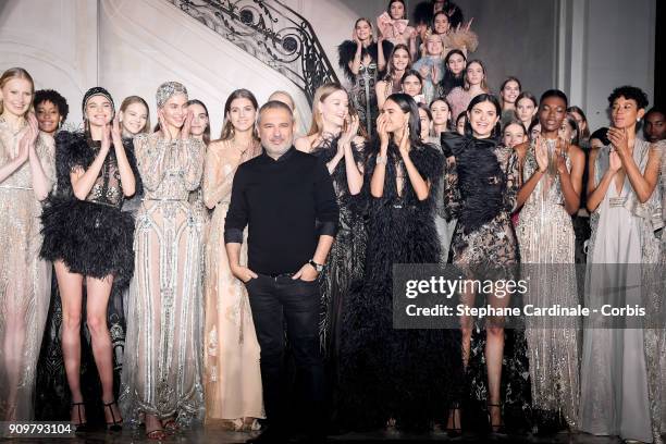 Fashion designer Elie Saab poses with models after the Elie Saab Spring Summer 2018 show as part of Paris Fashion Week on January 24, 2018 in Paris,...