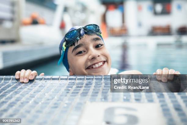 boy in pool for swim practice - swimming cap stock pictures, royalty-free photos & images