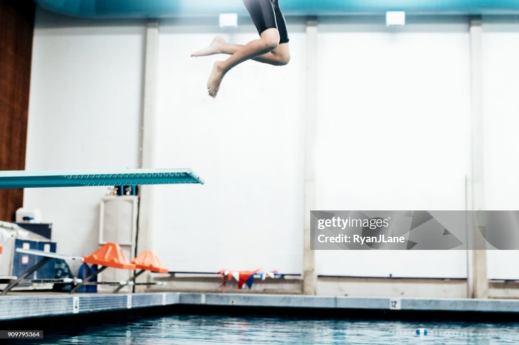 Boy In Pool on Diving Board