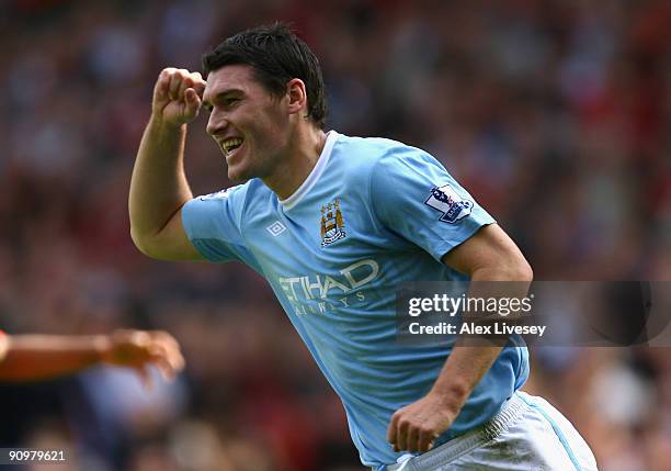 Gareth Barry of Manchester City celebrates scoring his team's first goal during the Barclays Premier League match between Manchester United and...