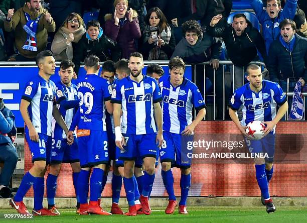 Alaves players celebrate their second goal during the Spanish 'Copa del Rey' quarter-final second leg football match between Deportivo Alaves and...