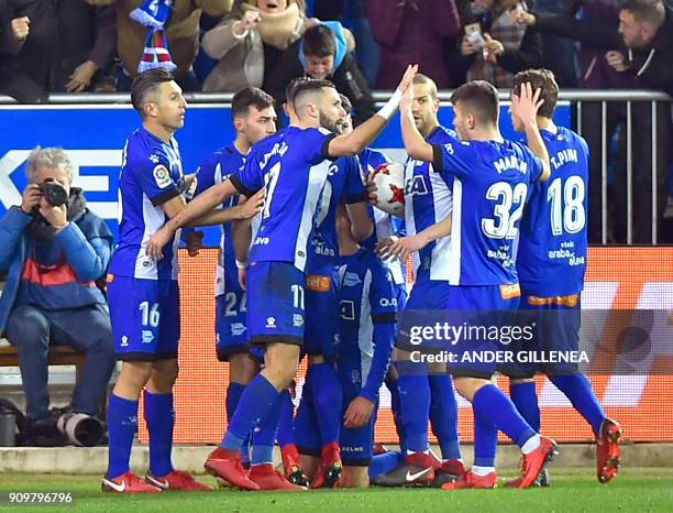 Alaves players celebrate their second goal during the Spanish 'Copa del Rey' quarter-final second leg football match between Deportivo Alaves and...