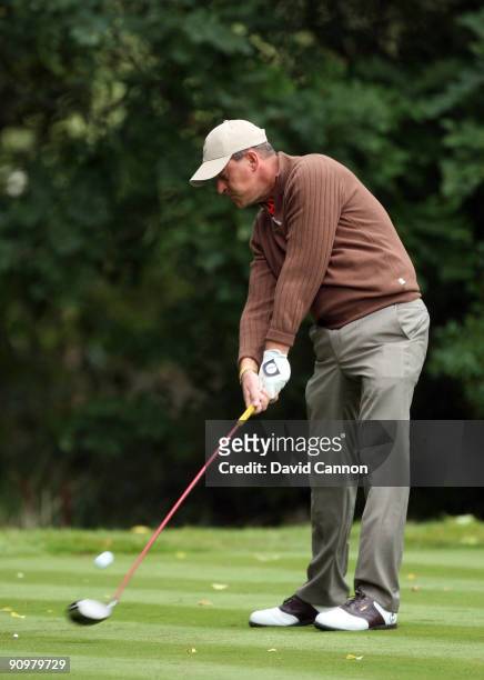Jon Bevan of the Great Britain and Ireland Team on the tee at the 4th hole during the final day singles matches at The Carrick on Loch Lomond on...