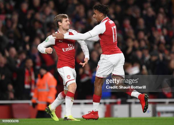 Nacho Monreal of Arsenal and Alex Iwobi celebrate the own goal of Antonio Rudiger of Chelsea during the Carabao Cup Semi-Final Second Leg at Emirates...