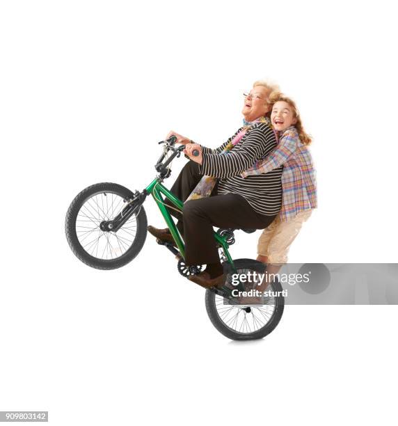 wheelie grandma and child - children funny moments stock pictures, royalty-free photos & images