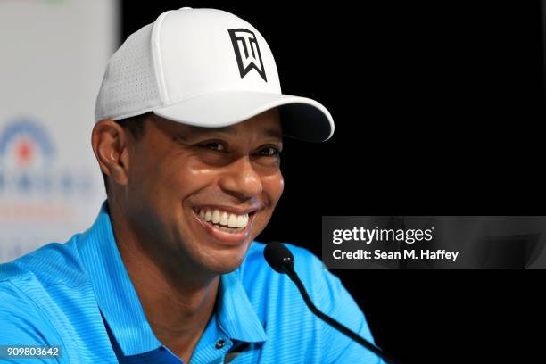 Tiger Woods laughs during a press conference after playing in the pro-am round of the Farmers Insurance Open at Torrey Pines Golf Course on January...