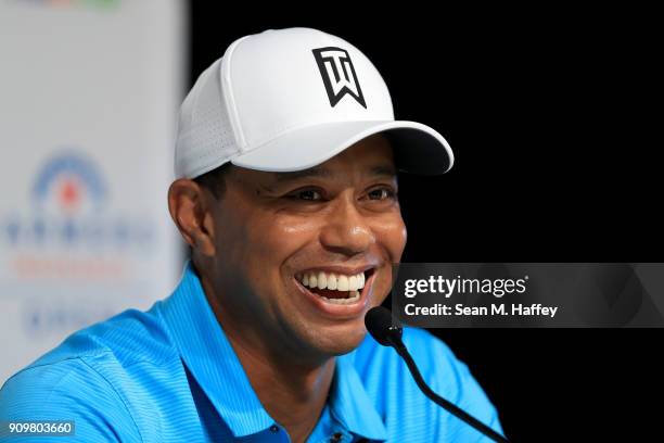 Tiger Woods laughs during a press conference after playing in the pro-am round of the Farmers Insurance Open at Torrey Pines Golf Course on January...