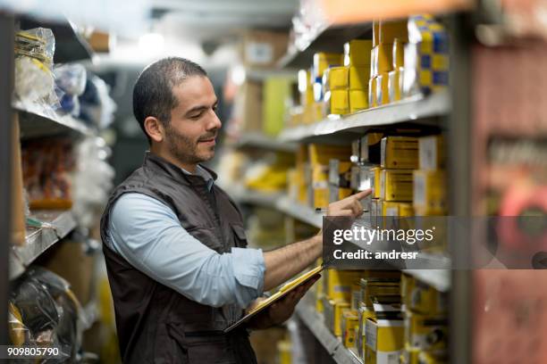 business owner working at a hardware store - stationary stock pictures, royalty-free photos & images