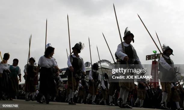 People take part in the marksmen's parade on the second day of the Oktoberfest beer festival on September 20, 2009 at the "Theresienwiese" in Munich,...