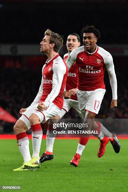 Arsenal's Spanish defender Nacho Monreal celebrates scoring the team's first goal during the League Cup semi-final football match between Arsenal and...