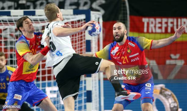 Spain's Viran Morros de Argila and Joan Canellas vie with Germany's Julius Kuhn during the group II match of the Men's 2018 EHF European Handball...