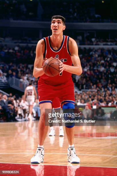 Gheorghe Muresan of the Washington Bullets shoots a foul shot during a game played on November 5, 1994 at the United Center in Chicago, Illinois....