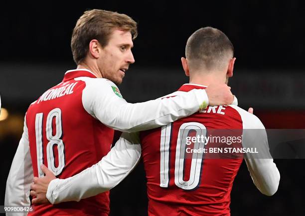 Arsenal's Spanish defender Nacho Monreal celebrates scoring the team's first goal during the League Cup semi-final football match between Arsenal and...