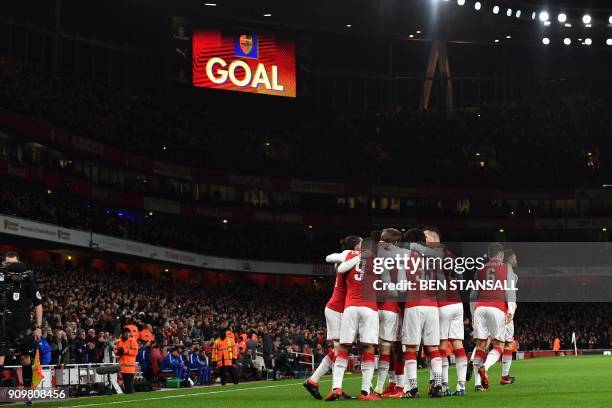 Arsenal's Spanish defender Nacho Monreal celebrates scoring the team's first goal during the League Cup semi-final football match between Arsenal and...