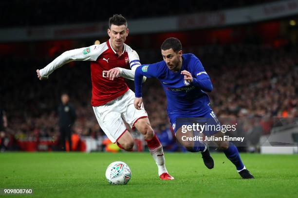 Eden Hazard of Chelsea and Laurent Koscielny of Arsenal in action during the Carabao Cup Semi-Final Second Leg at Emirates Stadium on January 24,...