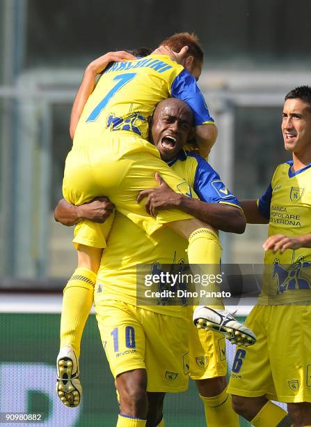 Michele Marcolini of Chievo Verona celebrates his pening goal with teammate Siqueira Luciano during the Serie A match between AC Chievo Verona and...