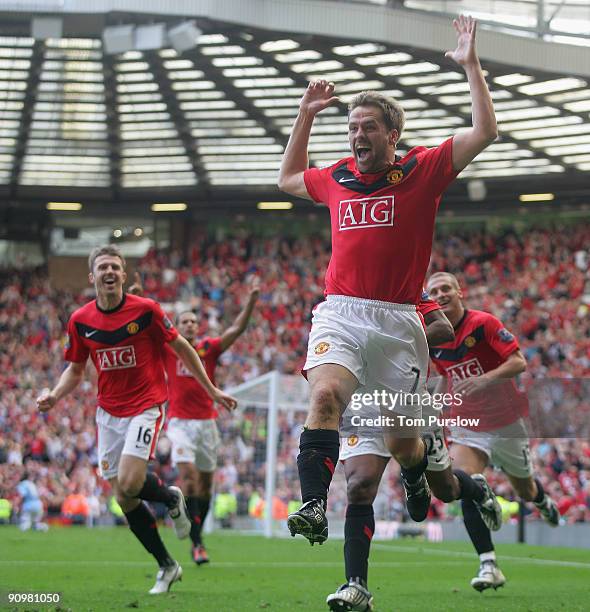 Michael Owen of Manchester United celebrates scoring their fourth goal during the Barclays Premier League match between Manchester United and...