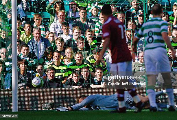 Artur Boruc of Celticlets in a shot by Suso Santana of Hearts during the Clydesdale Bank Scottish Premier league match between Celtic and Hearts at...