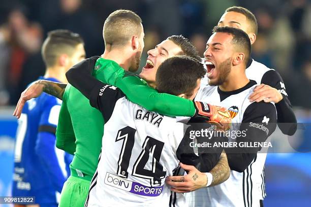 Valencia players celebrate at the end of the Spanish 'Copa del Rey' quarter-final second leg football match between Deportivo Alaves and Valencia CF...